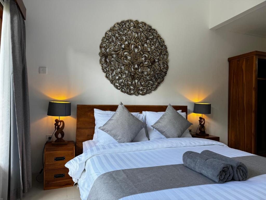 Postel nebo postele na pokoji v ubytování Kokokan House Ubud