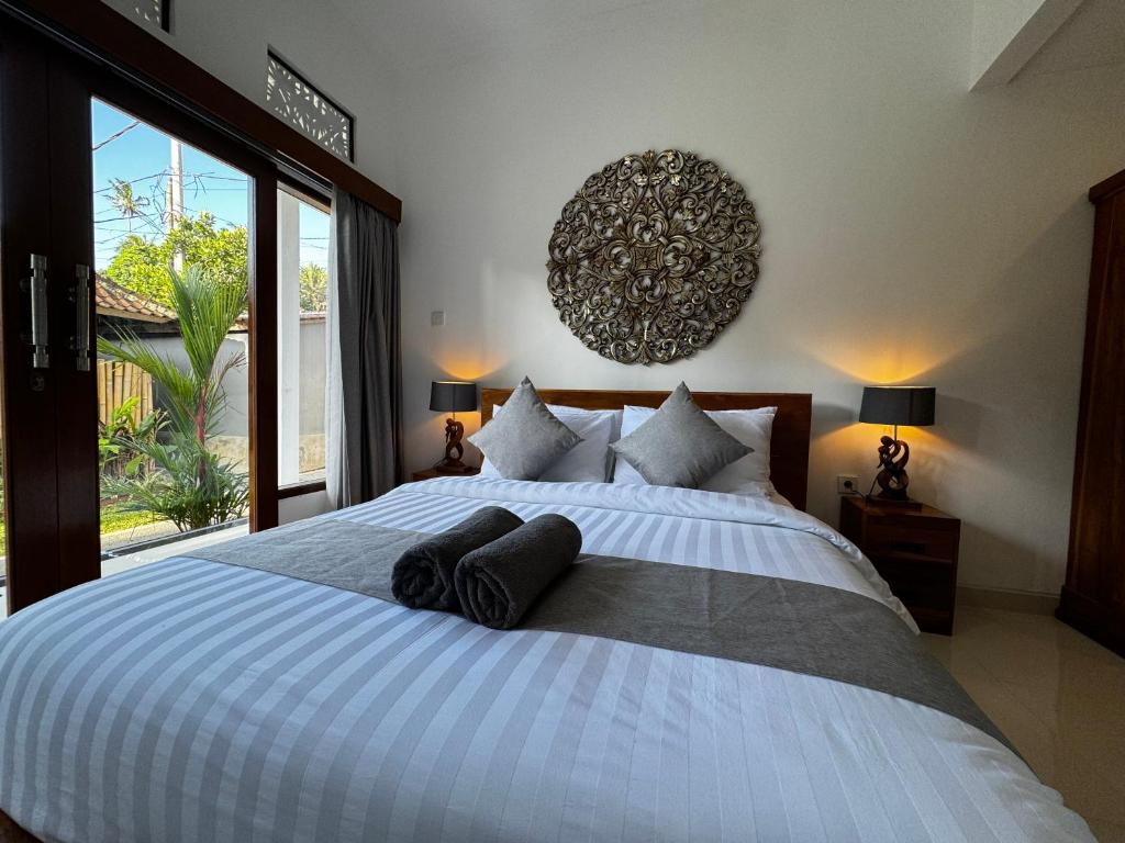 Postel nebo postele na pokoji v ubytování Kokokan House Ubud