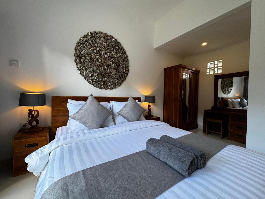 Postel nebo postele na pokoji v ubytování Kokokan House Ubud