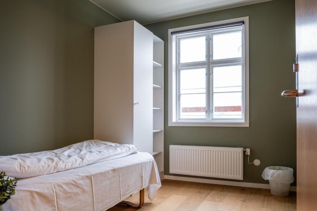 Postel nebo postele na pokoji v ubytování Solborg Folkehøgskole Hostel