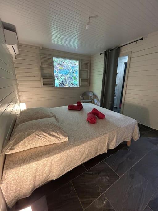 Postel nebo postele na pokoji v ubytování Nouveau ! Villa au Diamant