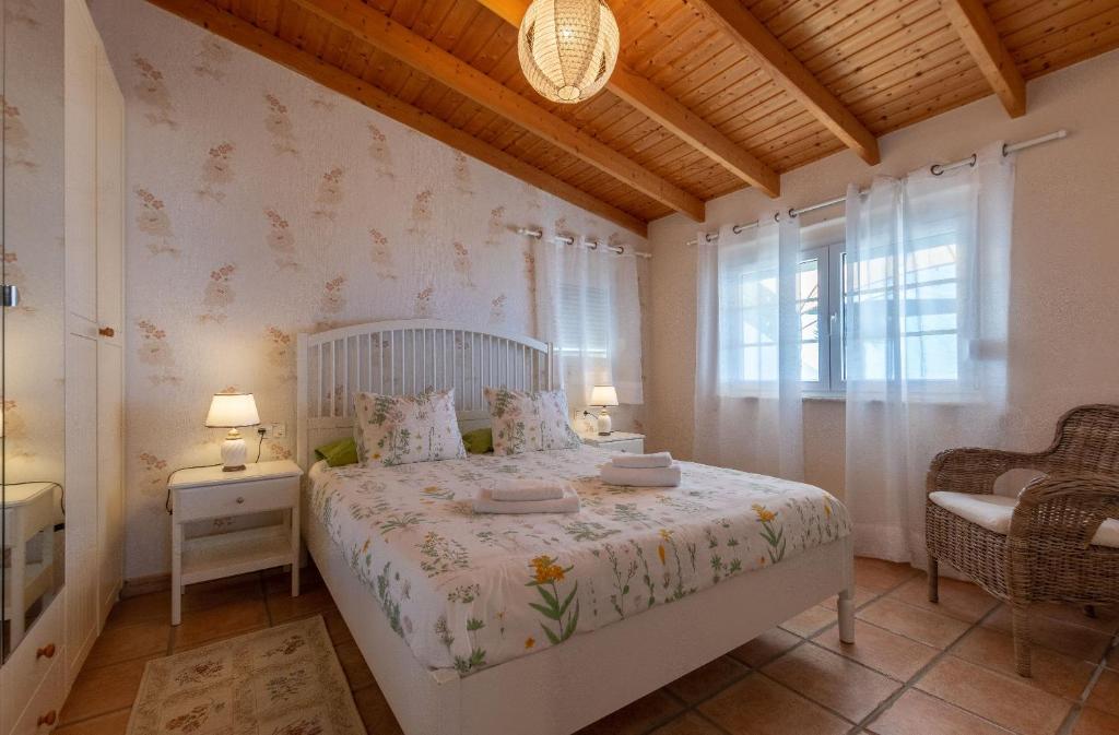 Posteľ alebo postele v izbe v ubytovaní Villa Hibisco, Jacuzzi y Vistas al Atlántico