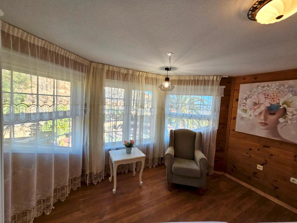 Posteľ alebo postele v izbe v ubytovaní Villa Carlitos vistas al Mar y a la montaña