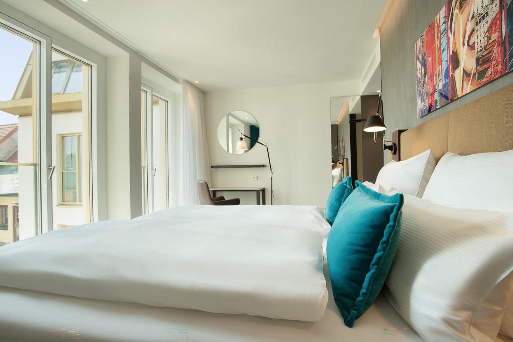 Ліжко або ліжка в номері Motel One Graz