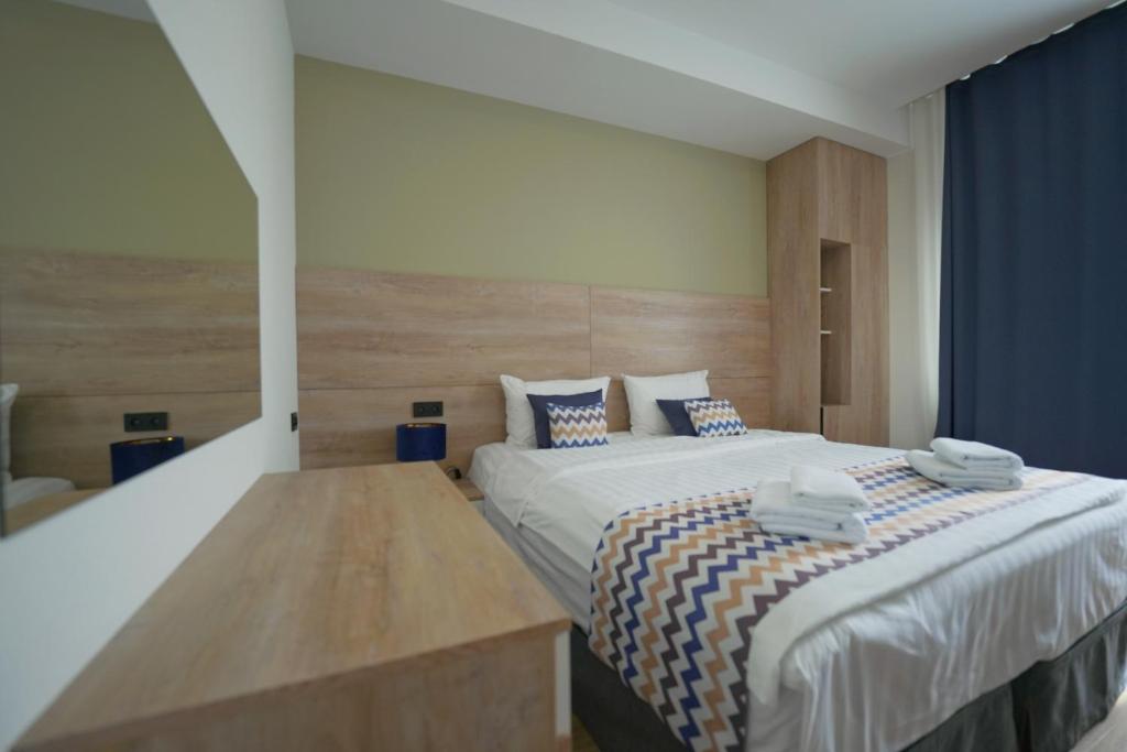 Postel nebo postele na pokoji v ubytování 4Guest Hotel