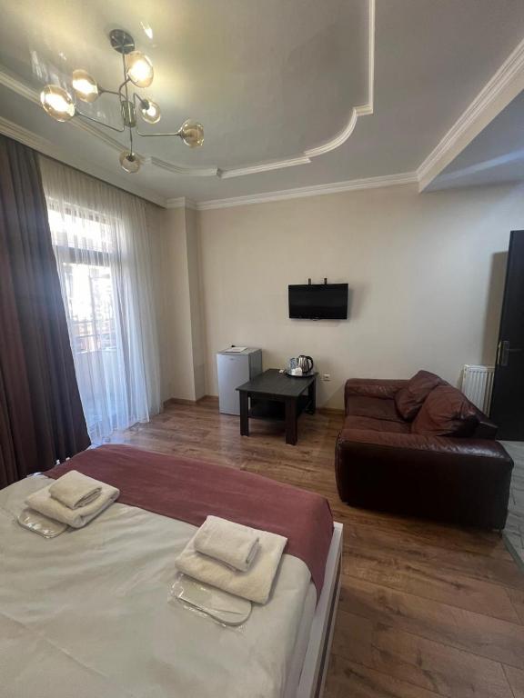 Postel nebo postele na pokoji v ubytování MAHALI HOTEL