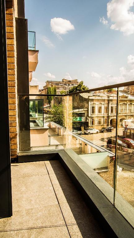 a balcony with a view of a city at Central Carol APARTHOTEL 2 in Bucharest