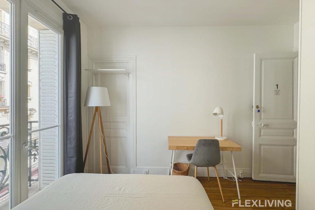 Postel nebo postele na pokoji v ubytování Flexliving - Room - Lamarck