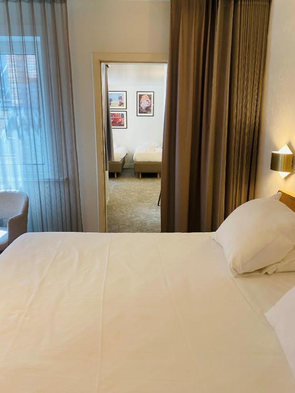 Postel nebo postele na pokoji v ubytování Hotel Prado