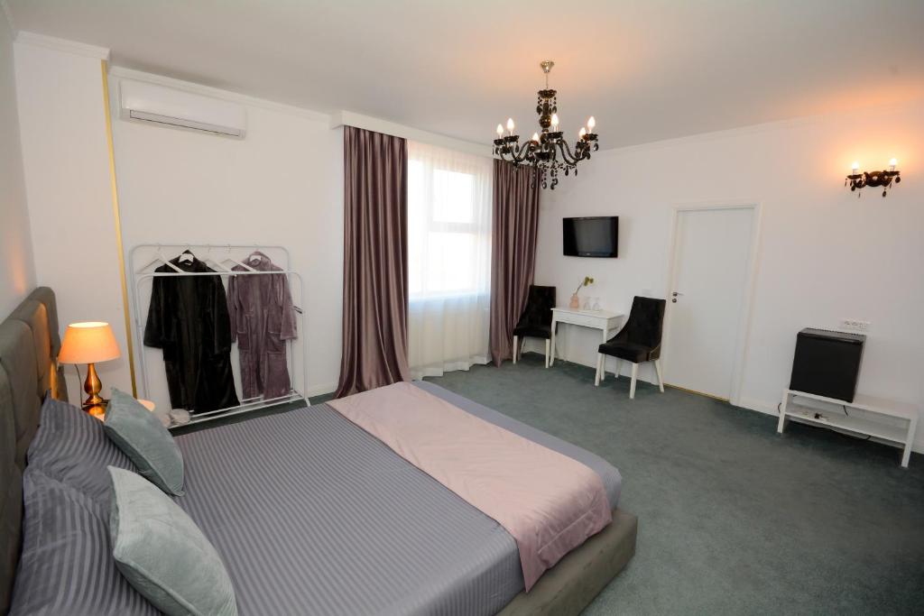 TV a/nebo společenská místnost v ubytování Hotel Andre´s