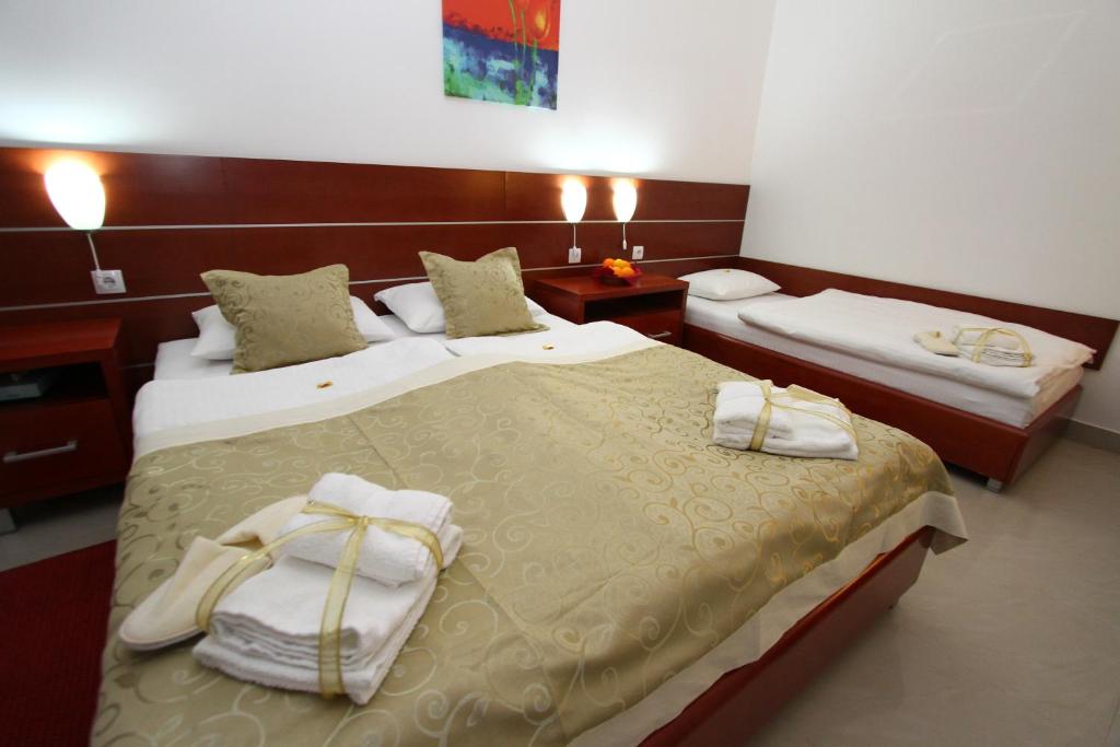 Postel nebo postele na pokoji v ubytování Guesthouse Villa Inn
