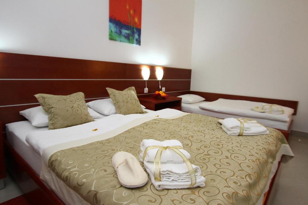 Postel nebo postele na pokoji v ubytování Guesthouse Villa Inn