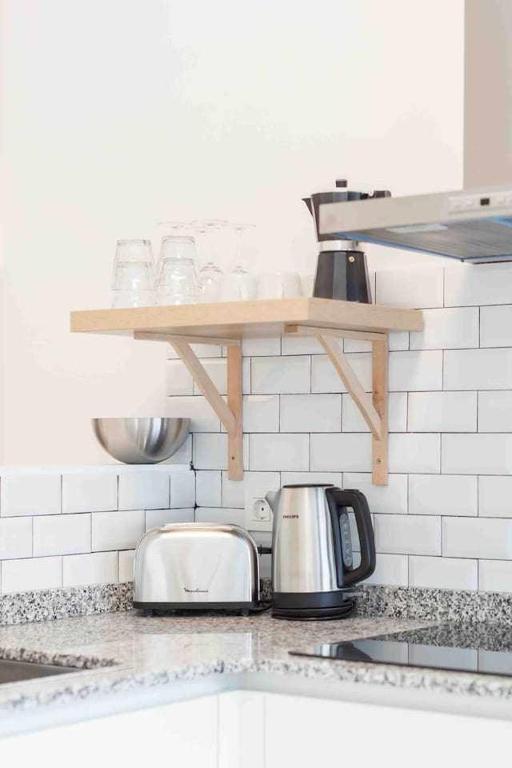 A kitchen or kitchenette at LUR Apartments Getaria