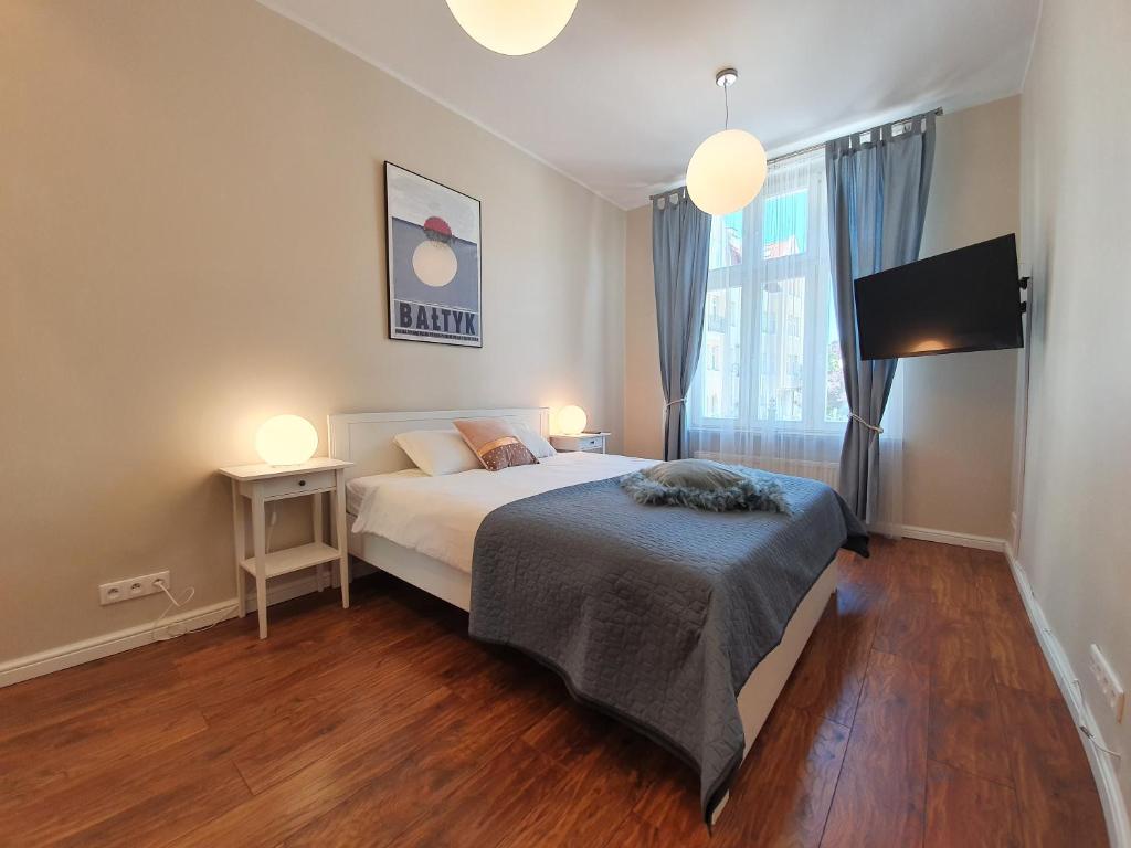 Posteľ alebo postele v izbe v ubytovaní Apartament Śliwka na Monte