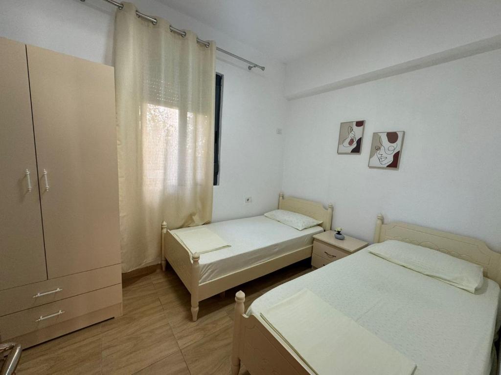 Postel nebo postele na pokoji v ubytování Villa Kurti