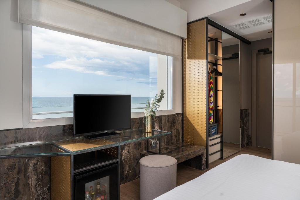 TV a/nebo společenská místnost v ubytování Hotel Michelangelo