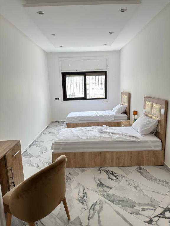 Postel nebo postele na pokoji v ubytování Room in shared apartment AGDAL RABAT
