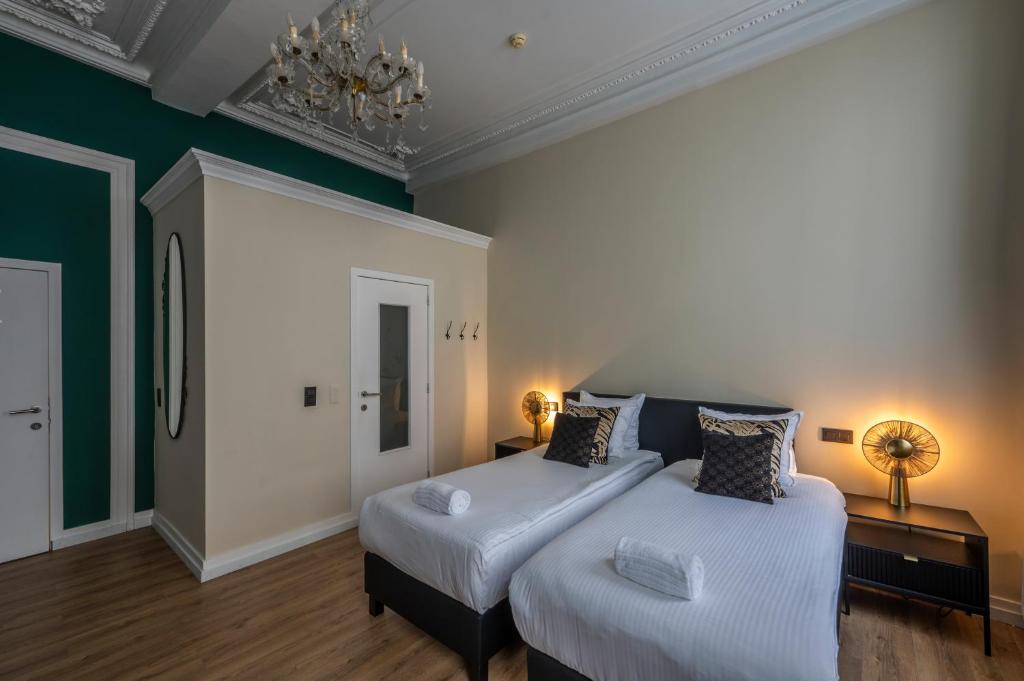 Postel nebo postele na pokoji v ubytování Hotel Onderbergen