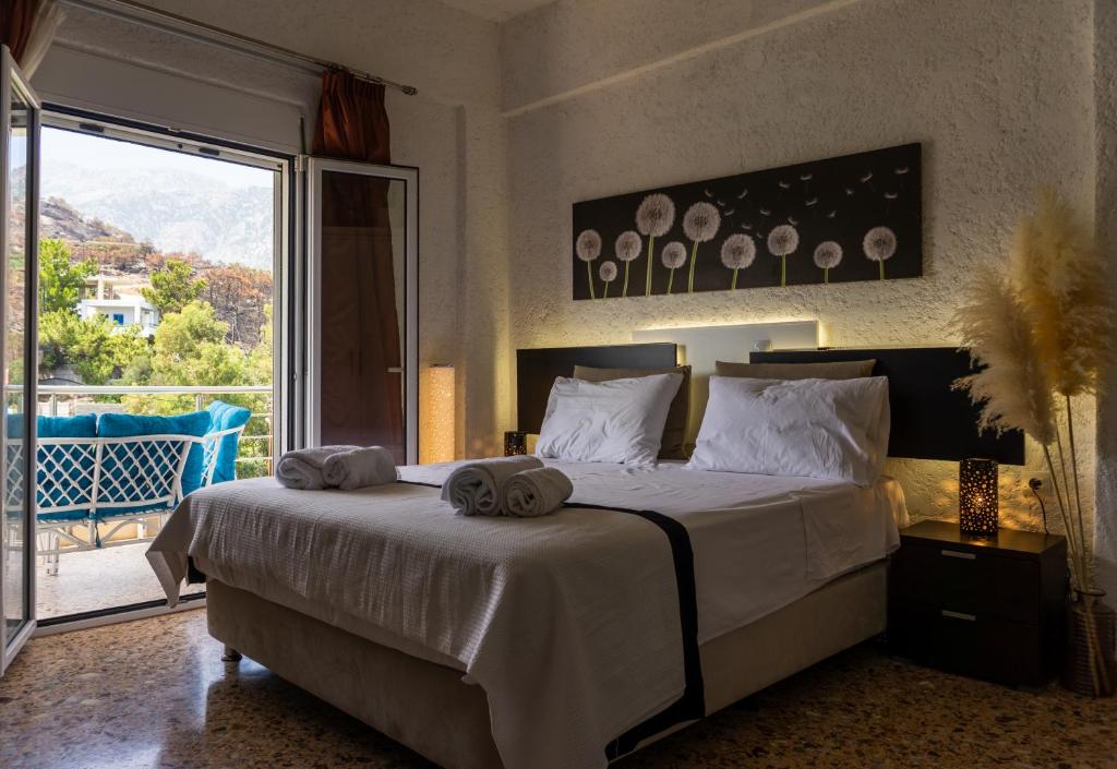 Postel nebo postele na pokoji v ubytování Pancratium #4 Seaside Apartment