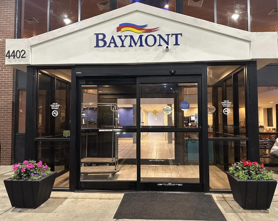 a building with a sign on the front of it at Baymont by Wyndham Indianapolis South in Indianapolis