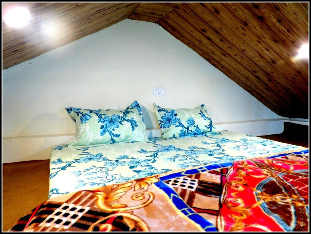 Postel nebo postele na pokoji v ubytování THE HIDEAWAY Homestay Chail