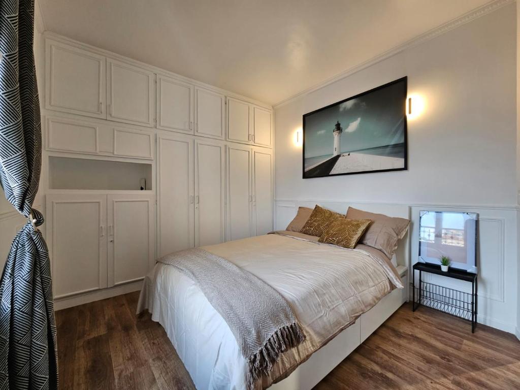 Katil atau katil-katil dalam bilik di Appartement luxe - Colombes