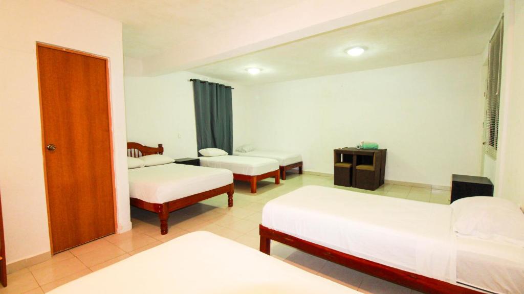 Postel nebo postele na pokoji v ubytování Hotel Vias Maya Bacalar