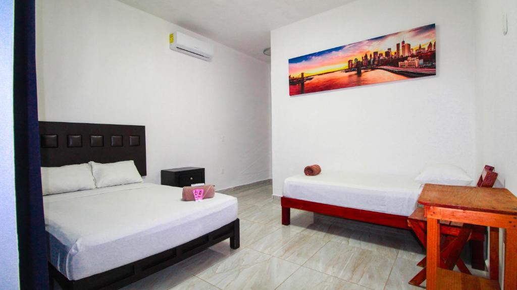 Postel nebo postele na pokoji v ubytování Hotel Vias Maya Bacalar