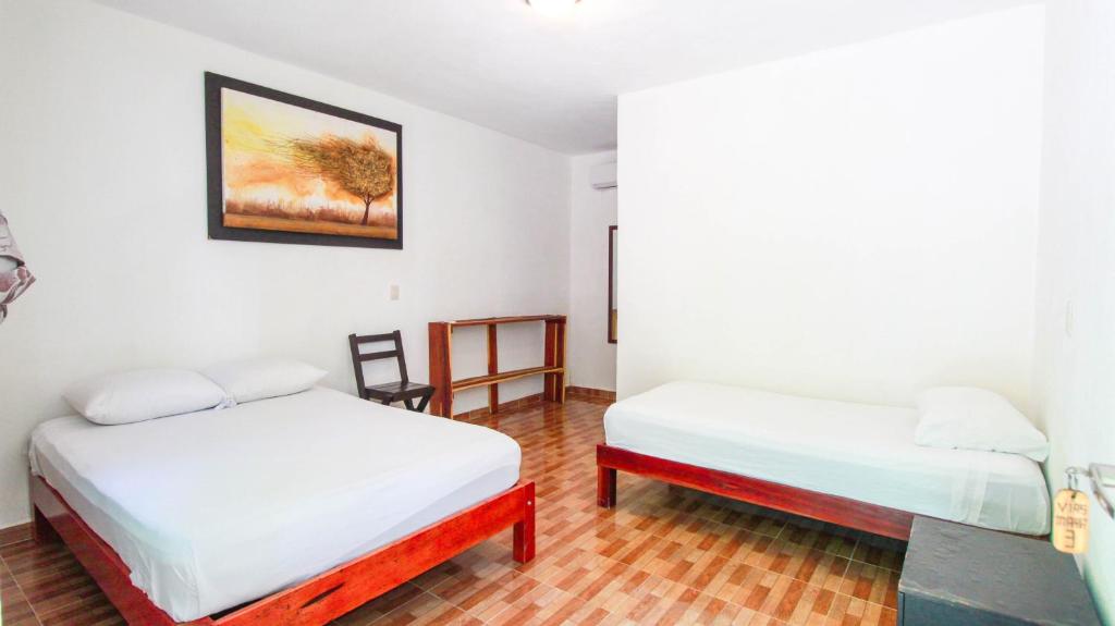 Postel nebo postele na pokoji v ubytování Hotel Vias Maya Bacalar