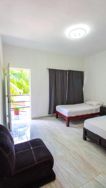 Postel nebo postele na pokoji v ubytování Hotel Vias Maya Bacalar
