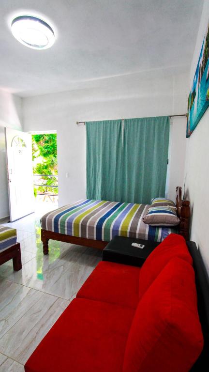 Postel nebo postele na pokoji v ubytování Hotel Vias Maya Bacalar