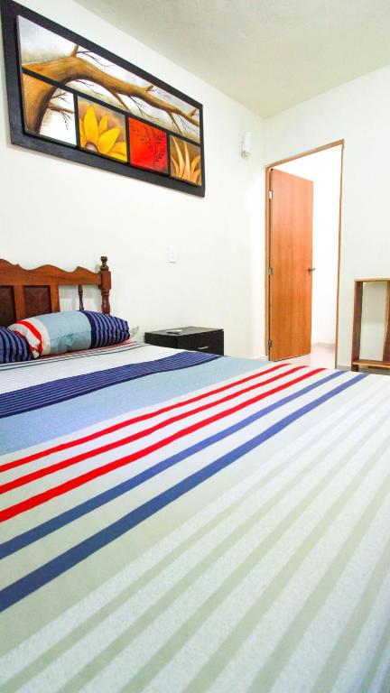 Postel nebo postele na pokoji v ubytování Hotel Vias Maya Bacalar