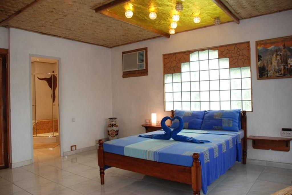 Postel nebo postele na pokoji v ubytování Princess of Coron Austrian Resort
