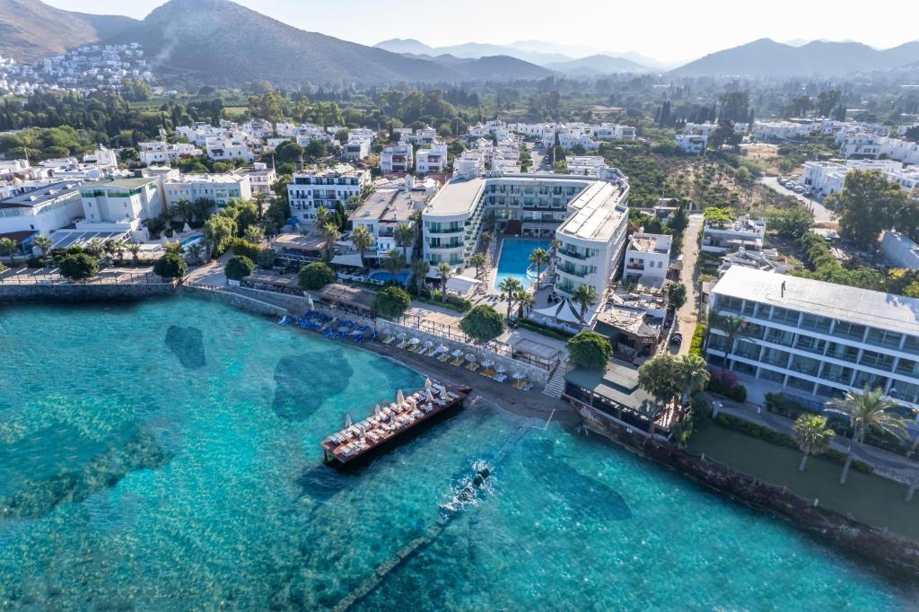 an aerial view of a city and a body of water at Dragut Point South Hotel-All Inclusive in Turgutreis