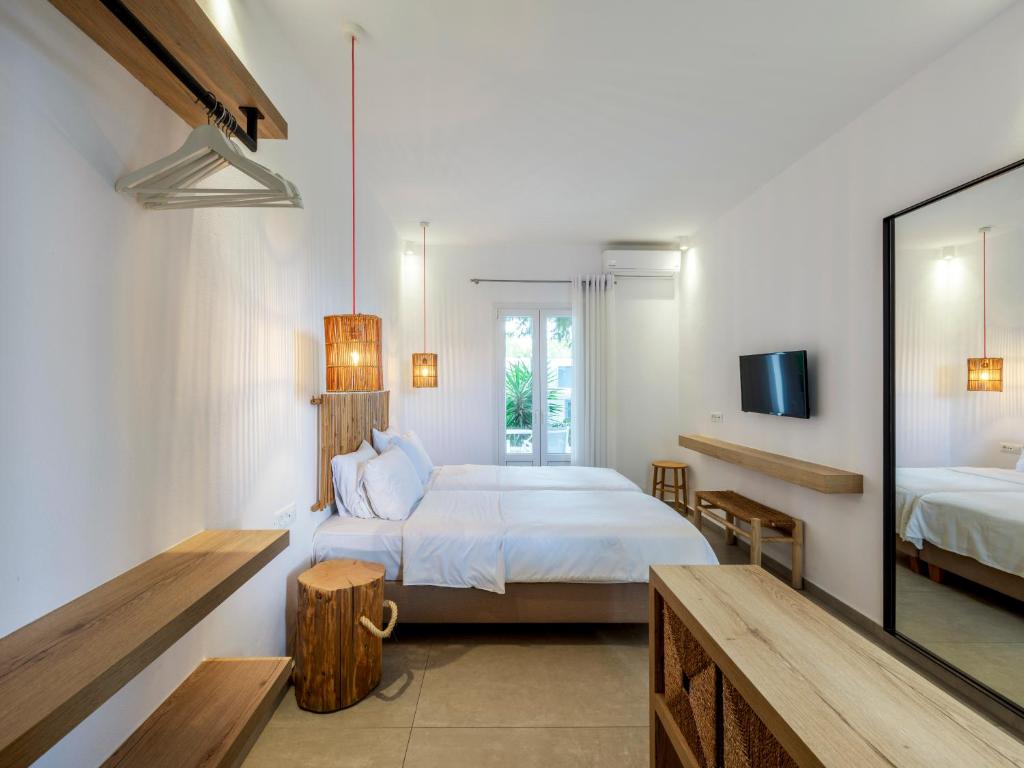 Postel nebo postele na pokoji v ubytování Jason Hotel