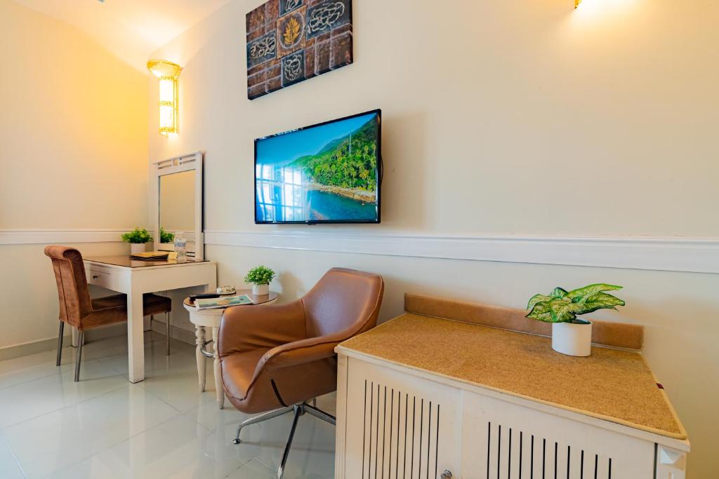 TV a/nebo společenská místnost v ubytování Fortune 1127 - Central Hotel
