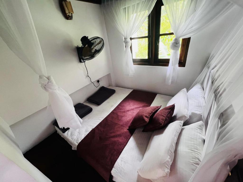 Postel nebo postele na pokoji v ubytování Rest Full Homestay