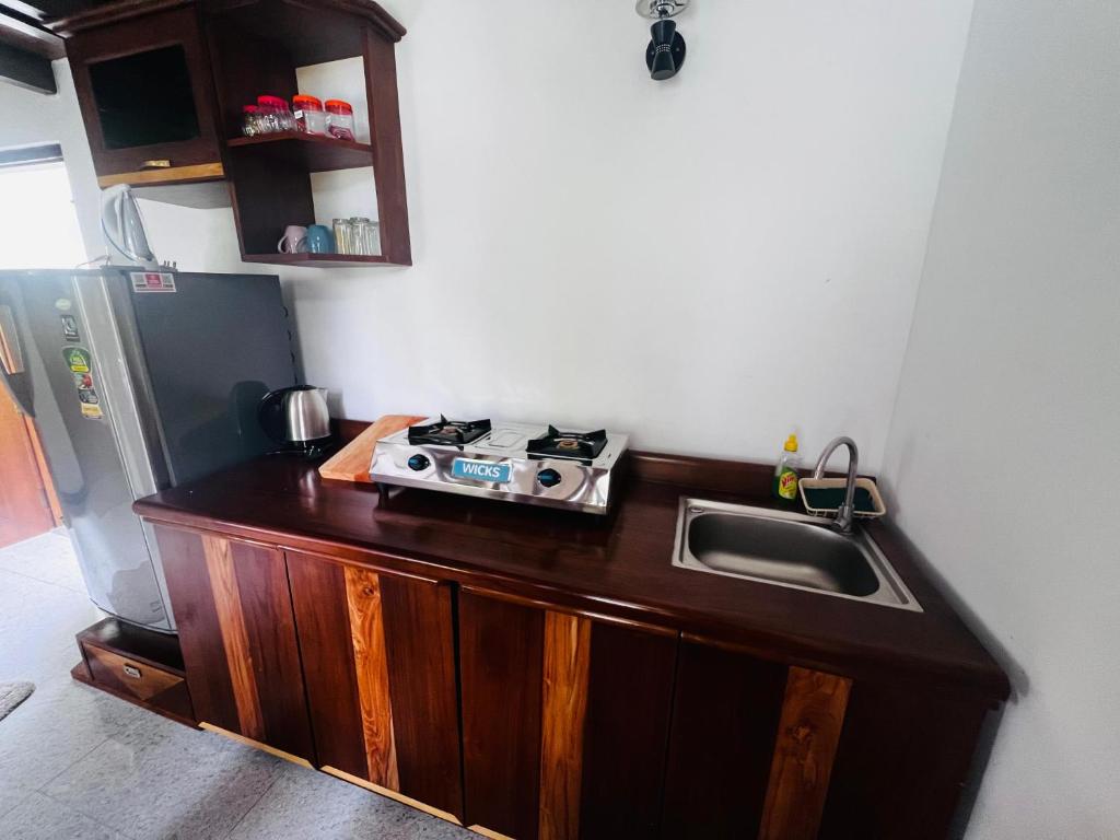 Kuchyň nebo kuchyňský kout v ubytování Rest Full Homestay