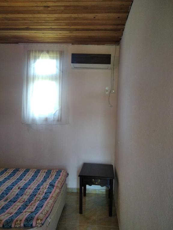 Postel nebo postele na pokoji v ubytování Hotel Poseidon