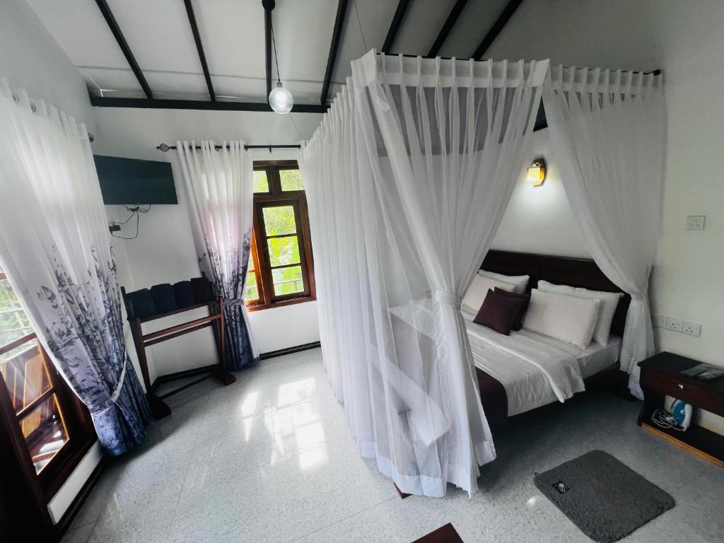 Postel nebo postele na pokoji v ubytování Rest Full Homestay
