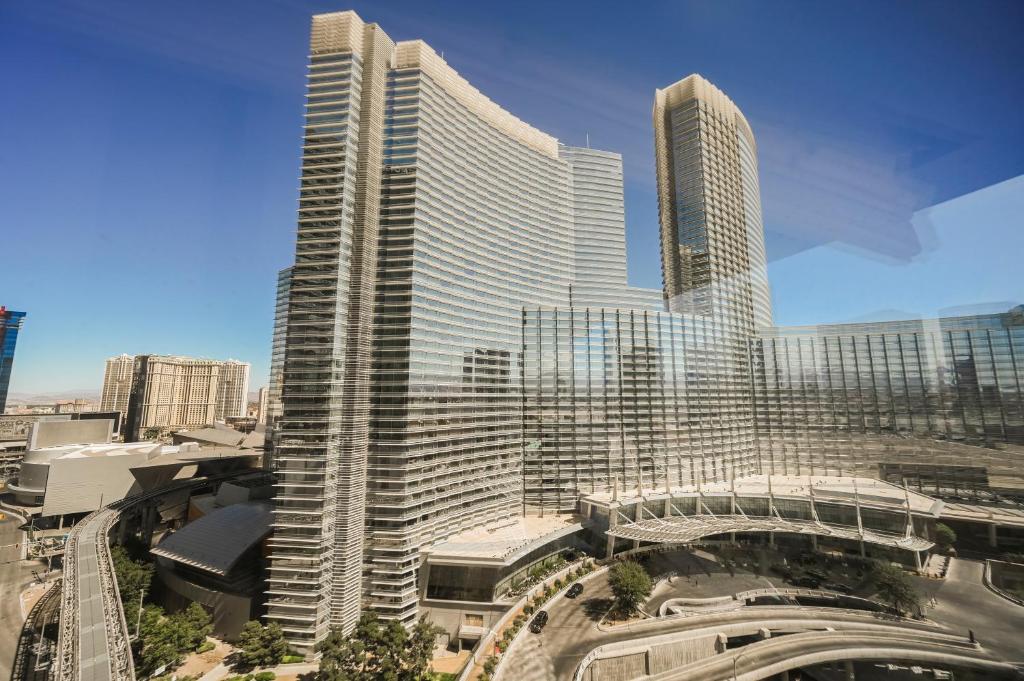 a rendering of a tall building in a city at StripViewSuites at Vdara in Las Vegas