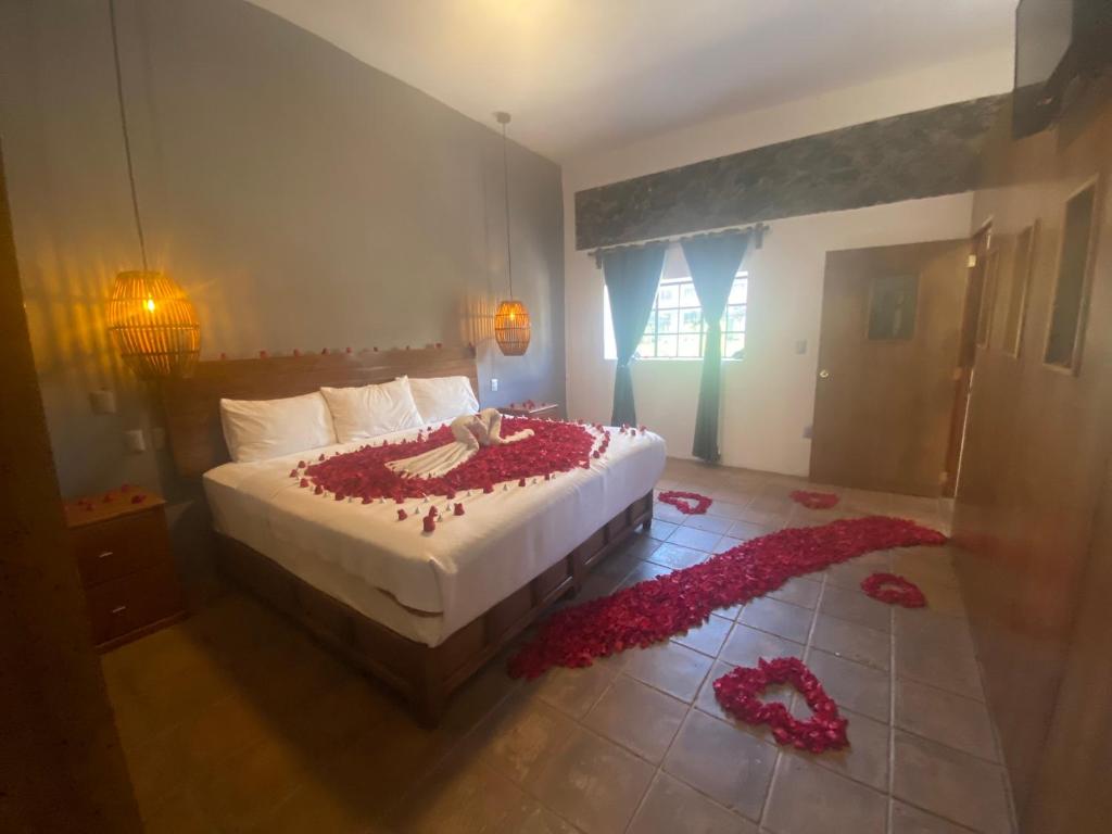 Postel nebo postele na pokoji v ubytování HOTEL EX HACIENDA EL MOLINO