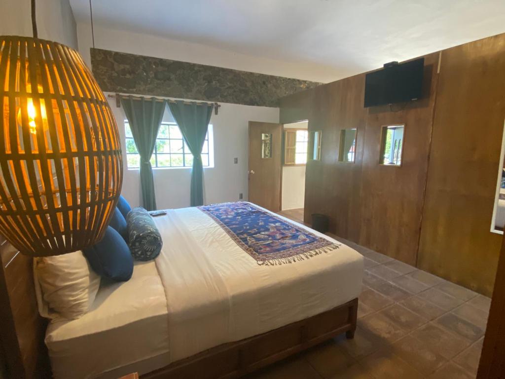 Postel nebo postele na pokoji v ubytování HOTEL EX HACIENDA EL MOLINO