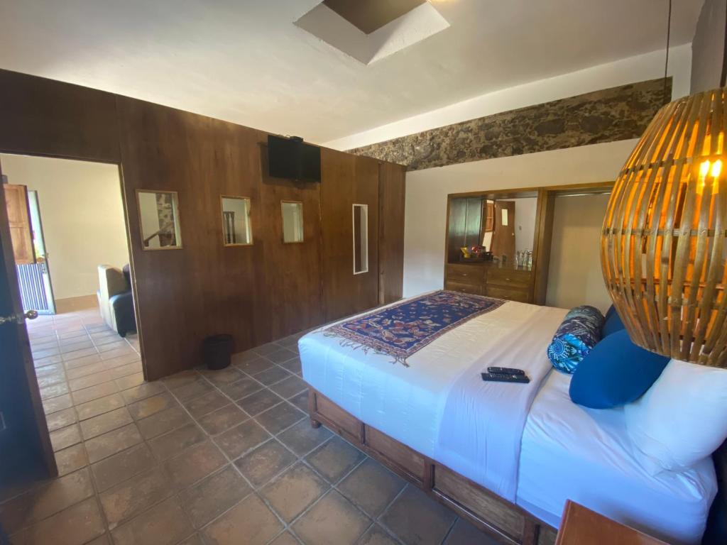 Postel nebo postele na pokoji v ubytování HOTEL EX HACIENDA EL MOLINO