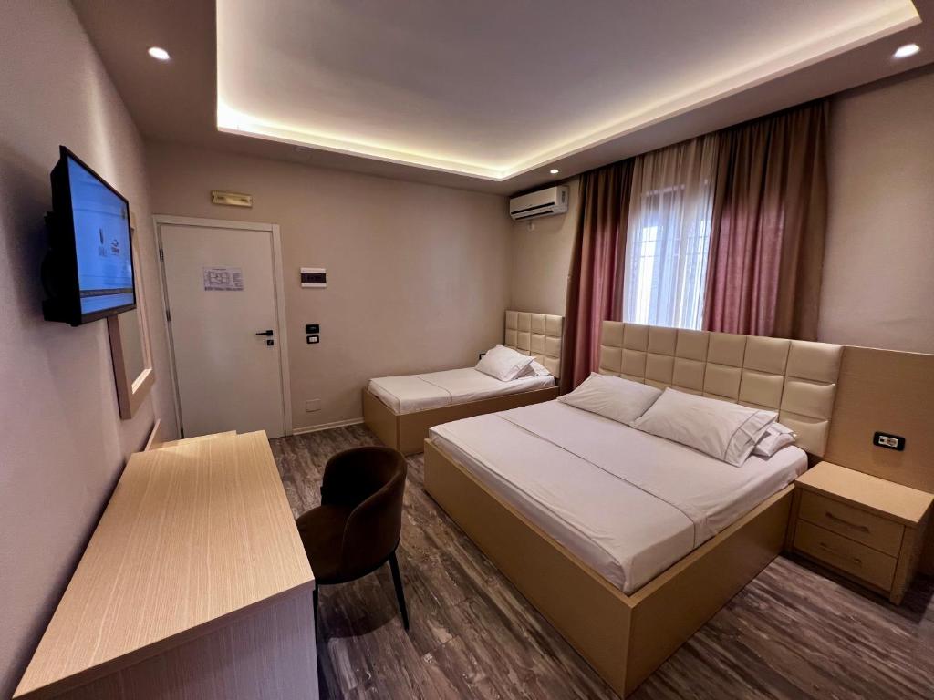Postel nebo postele na pokoji v ubytování Hotel Lungomare