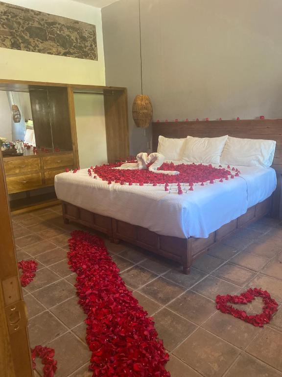 Postel nebo postele na pokoji v ubytování HOTEL EX HACIENDA EL MOLINO