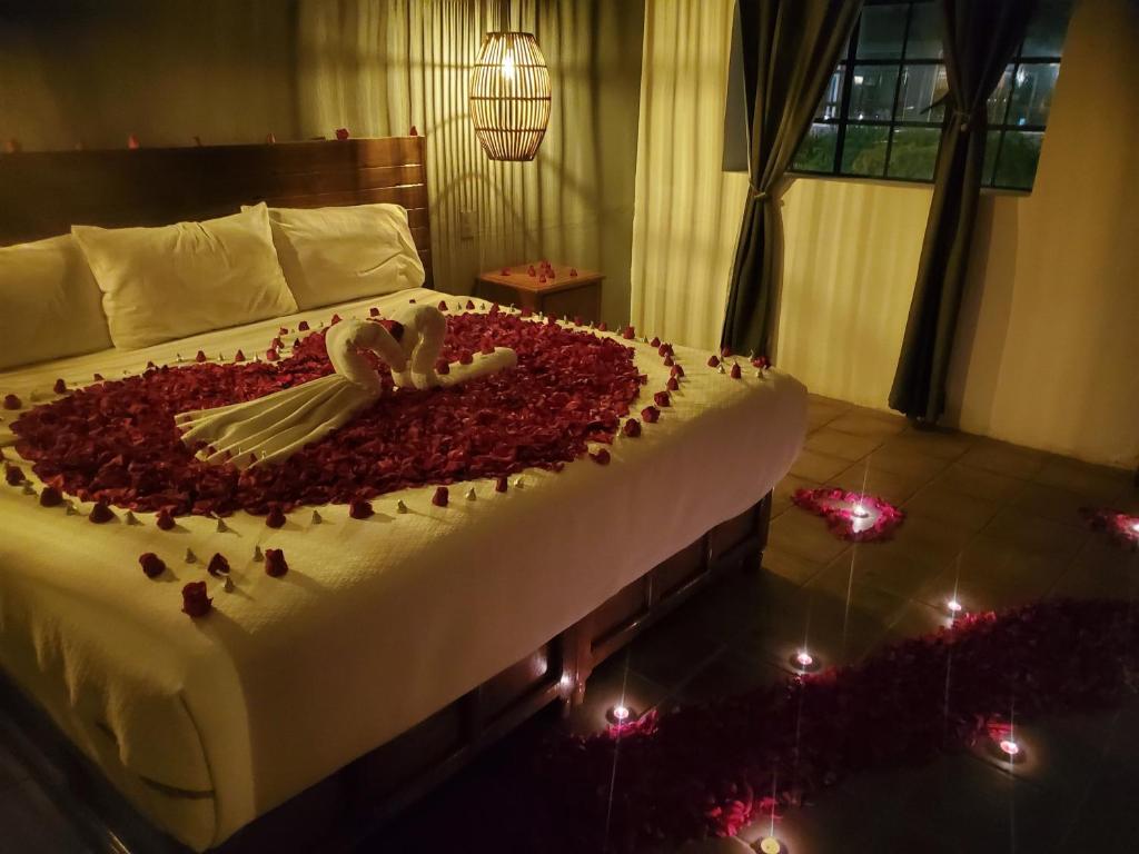 Postel nebo postele na pokoji v ubytování HOTEL EX HACIENDA EL MOLINO
