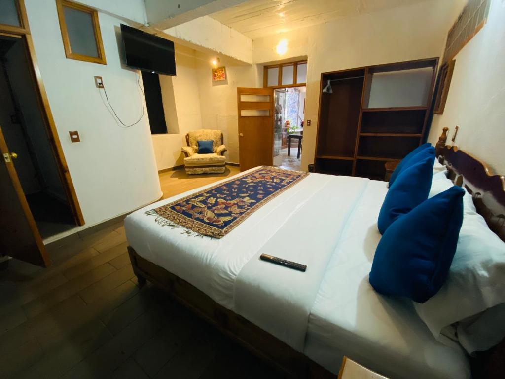 Postel nebo postele na pokoji v ubytování HOTEL EX HACIENDA EL MOLINO