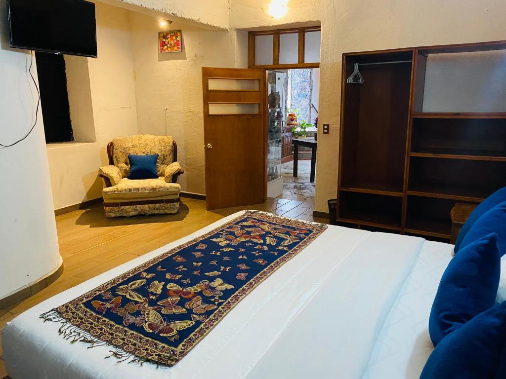 Postel nebo postele na pokoji v ubytování HOTEL EX HACIENDA EL MOLINO