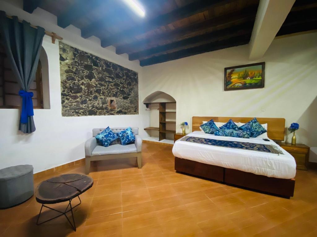 Postel nebo postele na pokoji v ubytování HOTEL EX HACIENDA EL MOLINO